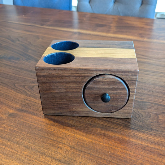 Wooden container with two blue compartments on a wooden surface